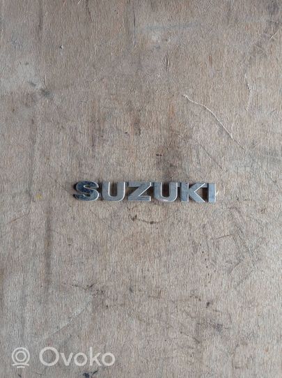 Suzuki SX4 Logo portiera di carico posteriore 24842