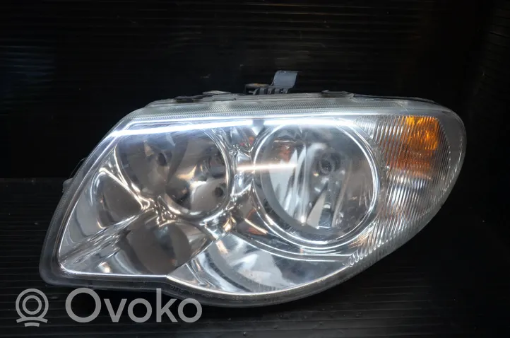 Chrysler Voyager Headlight/headlamp 04857831AC