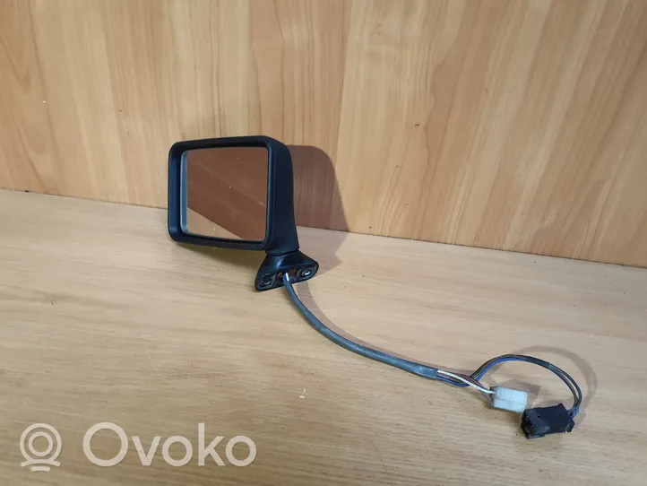 Volkswagen Golf II Front door electric wing mirror 192857501