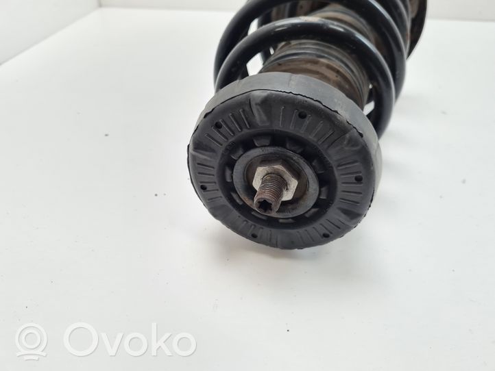 Opel Zafira C Front shock absorber with coil spring 13368504