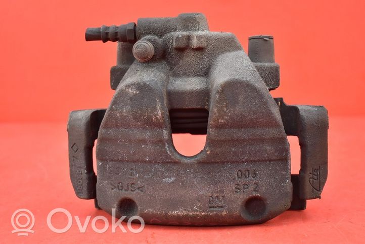 Opel Corsa E Caliper de freno delantero 