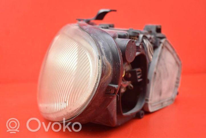 Chrysler Grand Voyager IV Lampa przednia 04857703AB