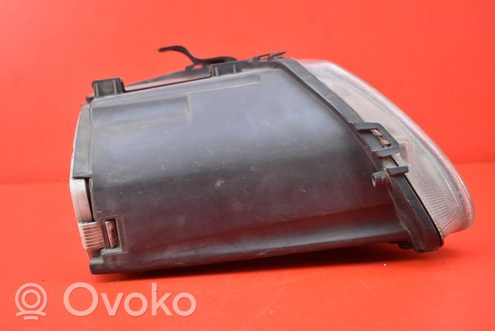 Chrysler Grand Voyager IV Lampa przednia 04857703AB