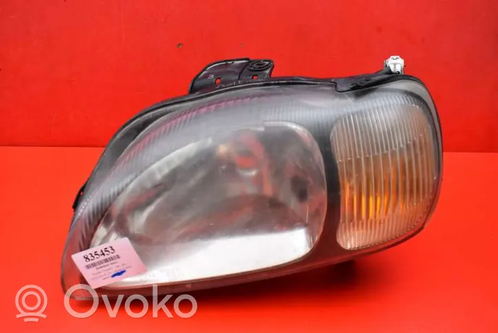 Suzuki Baleno EG Lampa przednia 100-32617