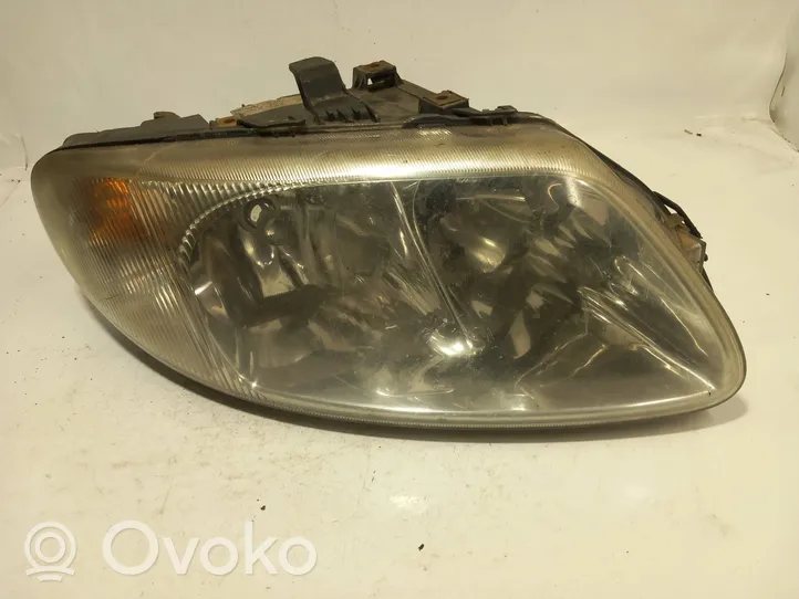 Chrysler Voyager Lampa przednia 04857702AB