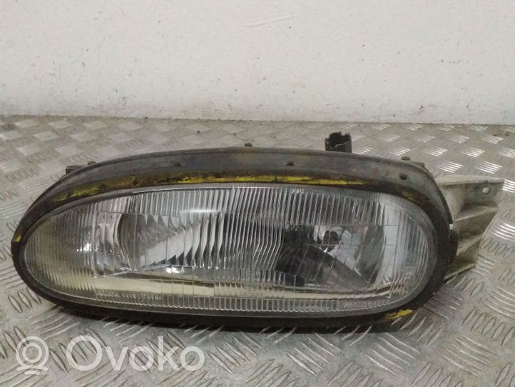 Nissan NX 100 Lampa przednia E13020289