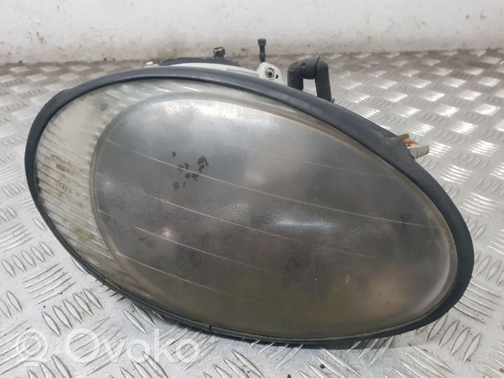 Ford Taurus Lampa przednia F7DB13005E