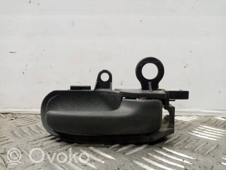 Toyota Yaris Verso Klamka wewnętrzna drzwi przednich 6920552010B0