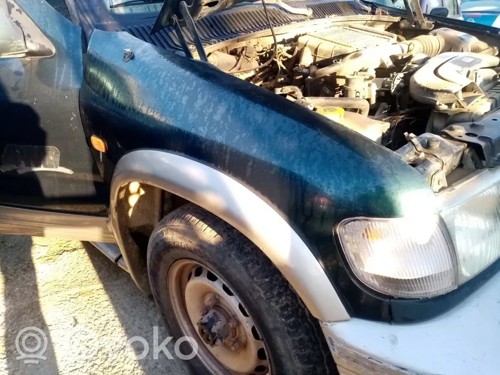 KIA Sportage Lokasuoja 0K00R52211