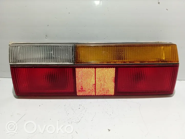 Volkswagen Polo Задний фонарь в кузове 873945112