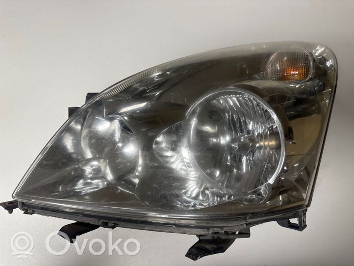 Toyota Corolla Verso E121 Lampa przednia 7357230400