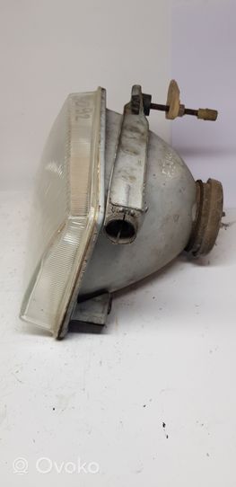 Ford Escort Lampa przednia 002124099