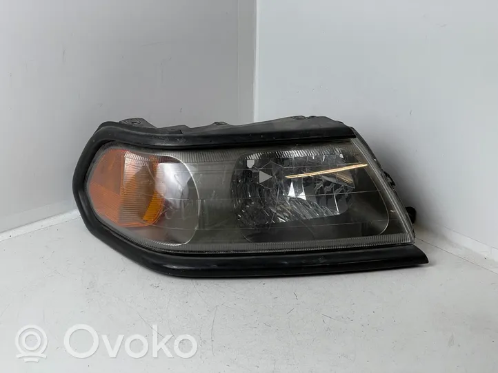 Mitsubishi Pajero Sport I Lampa przednia 10087415