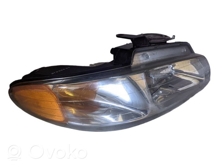 Chrysler Voyager Lampa przednia 083331110R