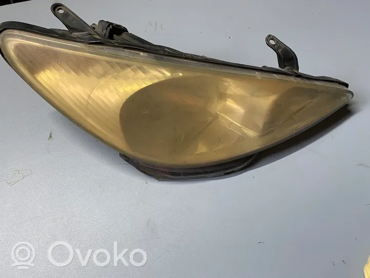 Toyota Previa (XR30, XR40) II Lampa przednia 9922680008