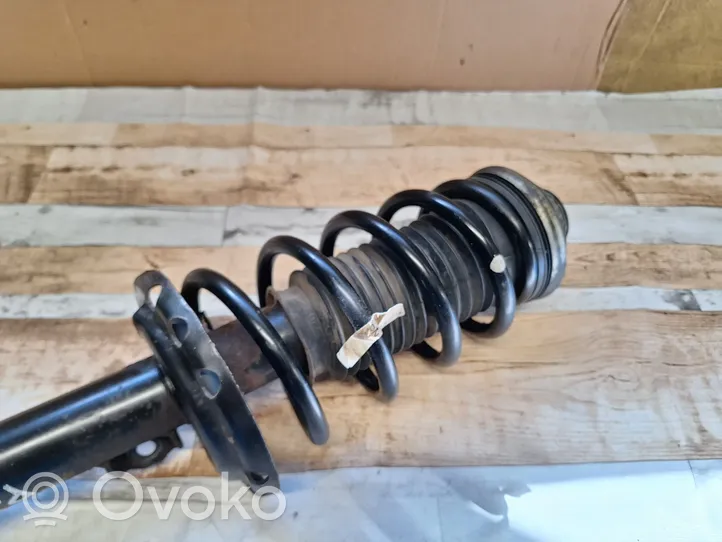 Opel Zafira B Front shock absorber with coil spring 22214012