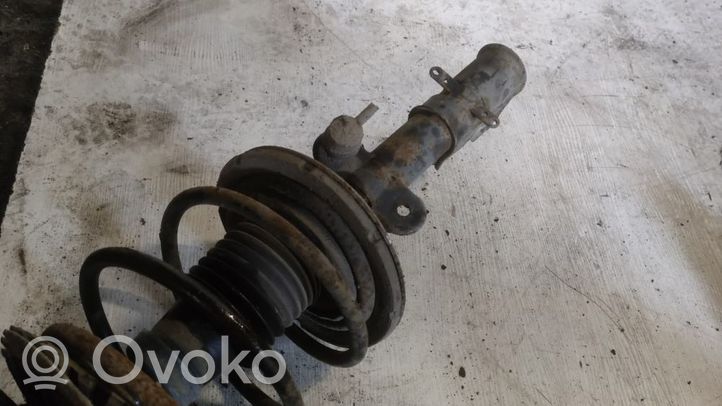 Dodge Grand Caravan Front shock absorber with coil spring 5135538AA