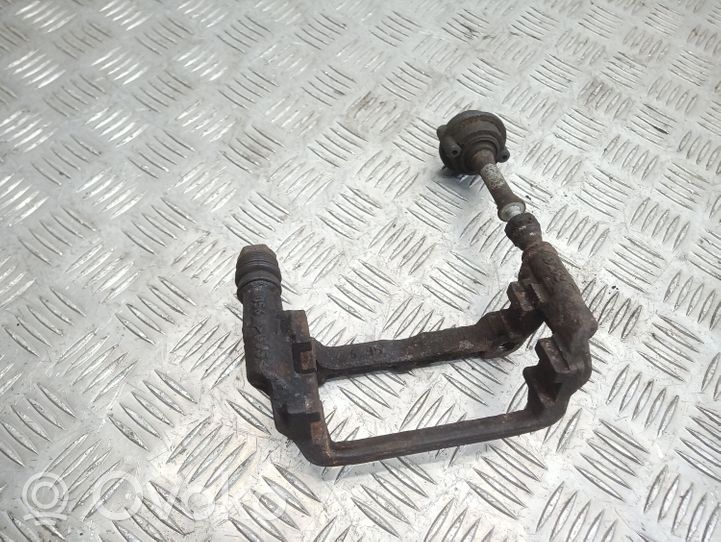 Opel Astra J Supporto della pinza del freno posteriore 