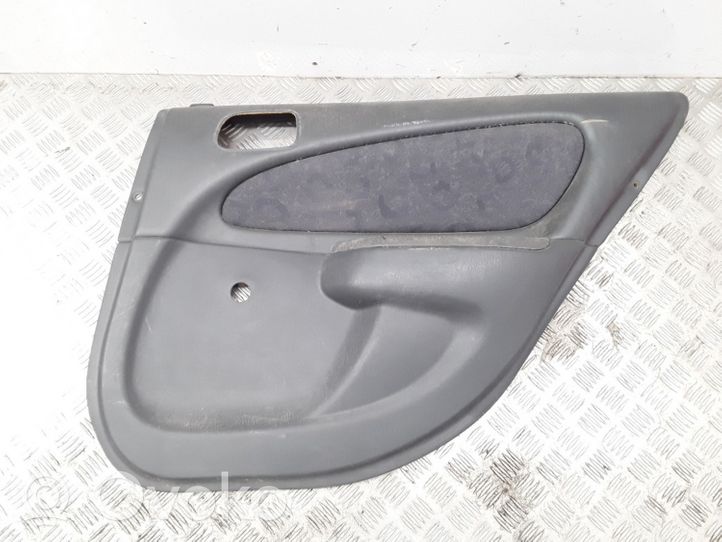 Toyota Corolla E110 Garniture panneau de porte arrière 6777512030