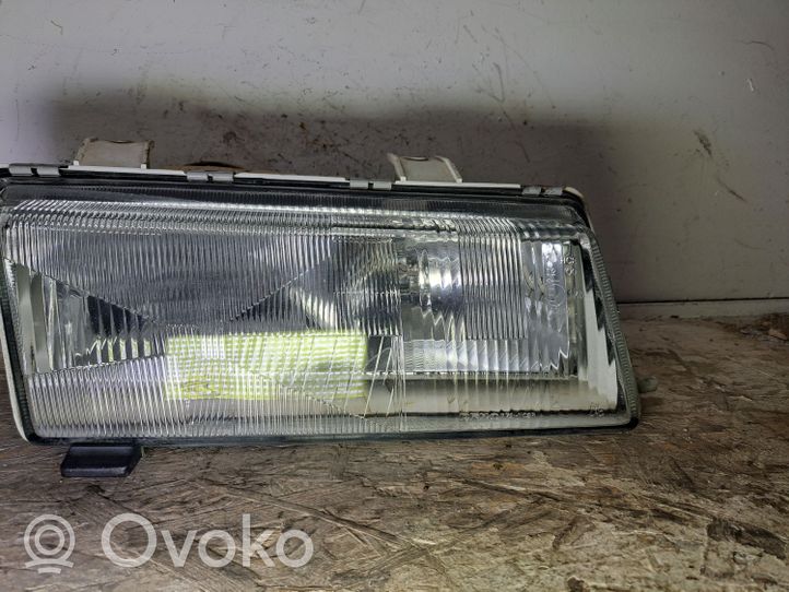 Saab 9000 CS Lampa przednia 7721102R