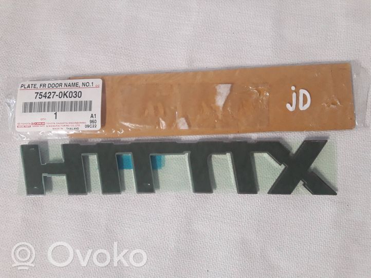 Toyota Hilux (AN120, AN130) Logo portiera di carico posteriore 754270K030