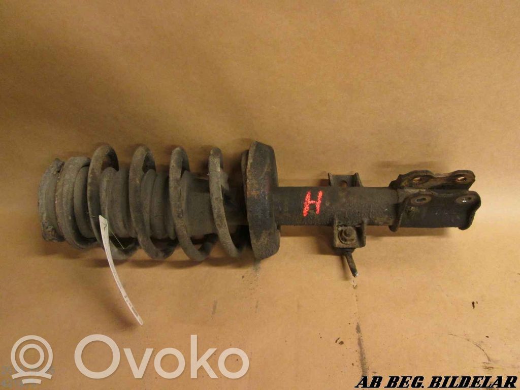 Front shock absorber with coil spring