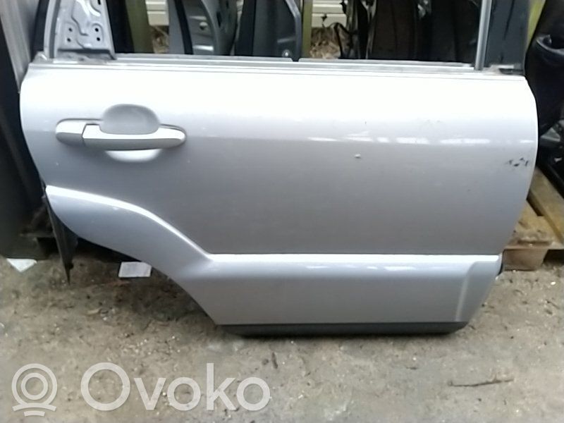 Puerta trasera   77004D9000