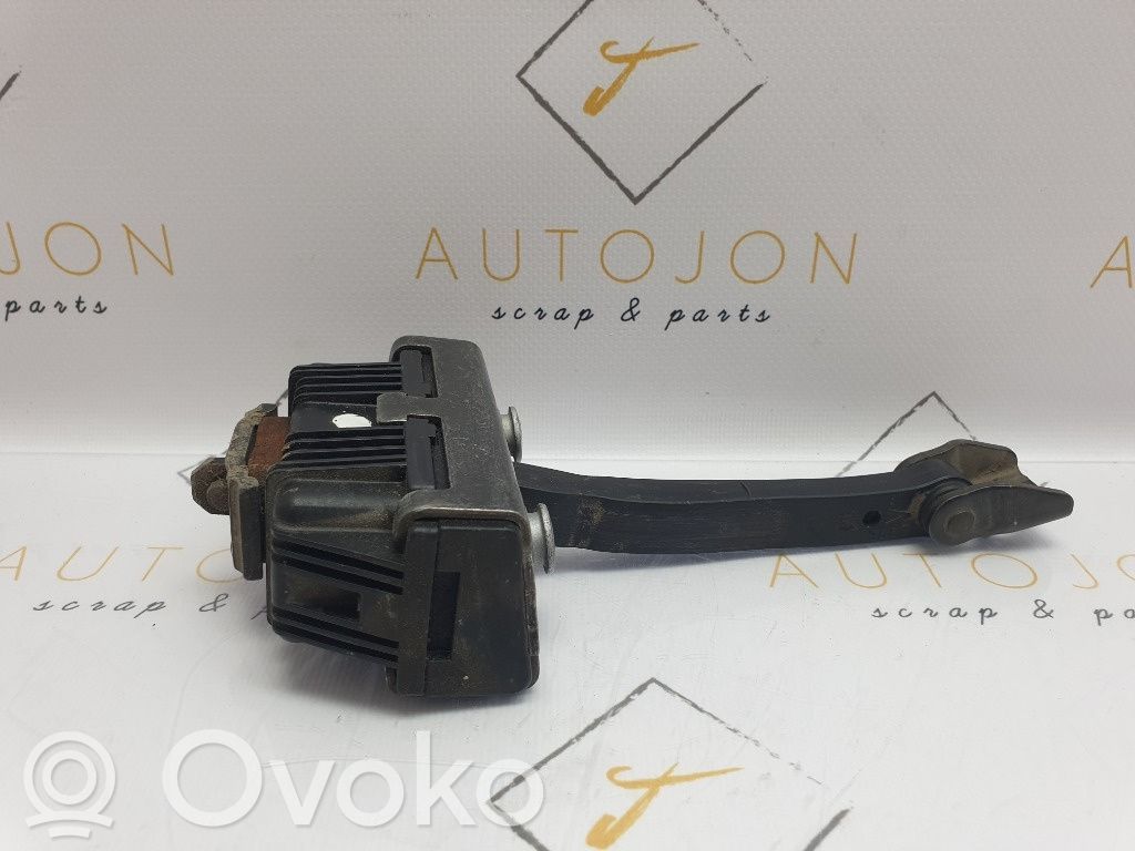 Front door check strap stopper   7176804
