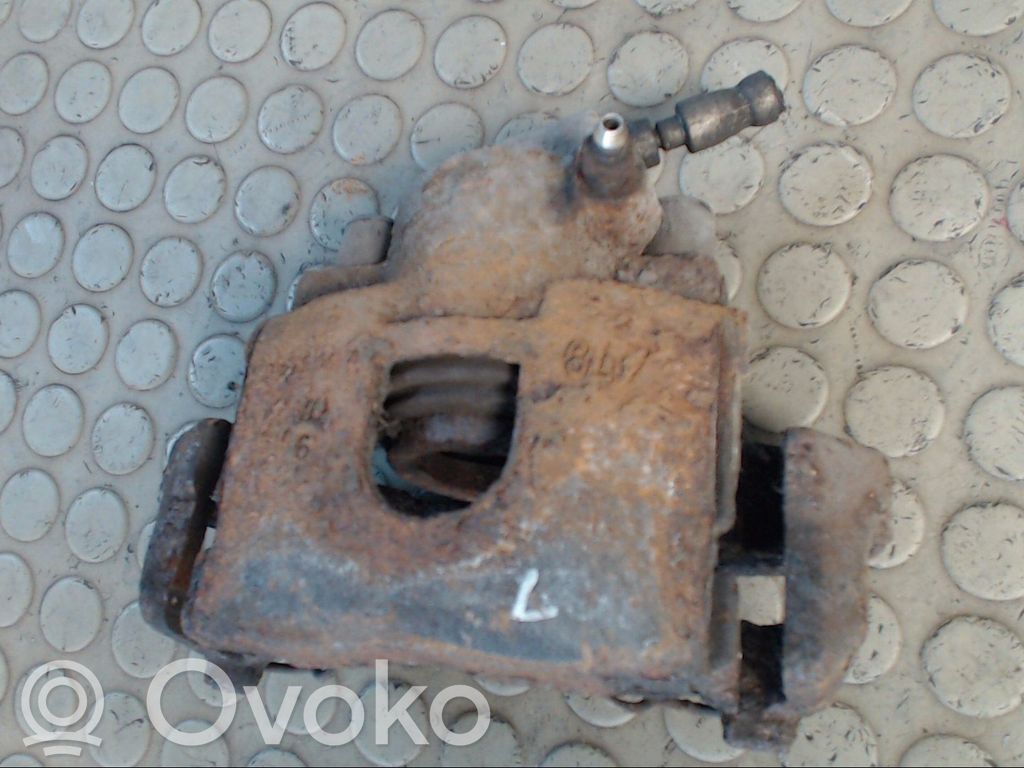 Mazda 121 SM Zacisk hamulcowy przedni 
