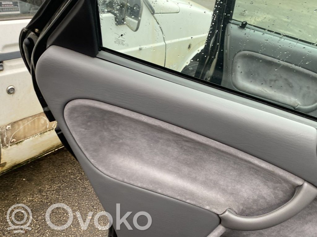 Saab 9-3 Ver1 Moldura del tarjetero de la puerta trasera 