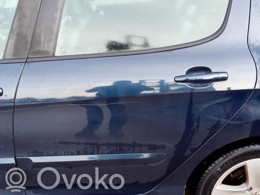 Peugeot 308 Szyba drzwi tylnych 