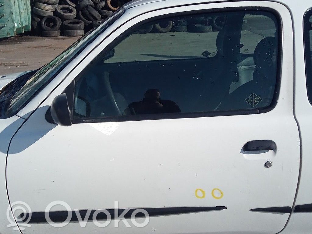 Nissan Micra Elektryczny podnośnik szyby drzwi przednich 