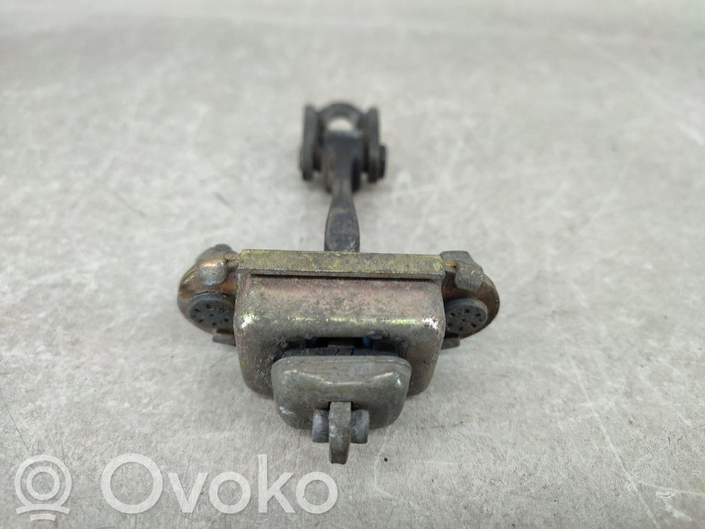 Front door check strap stopper   DIREITA,TRAS,XS4AA27200
