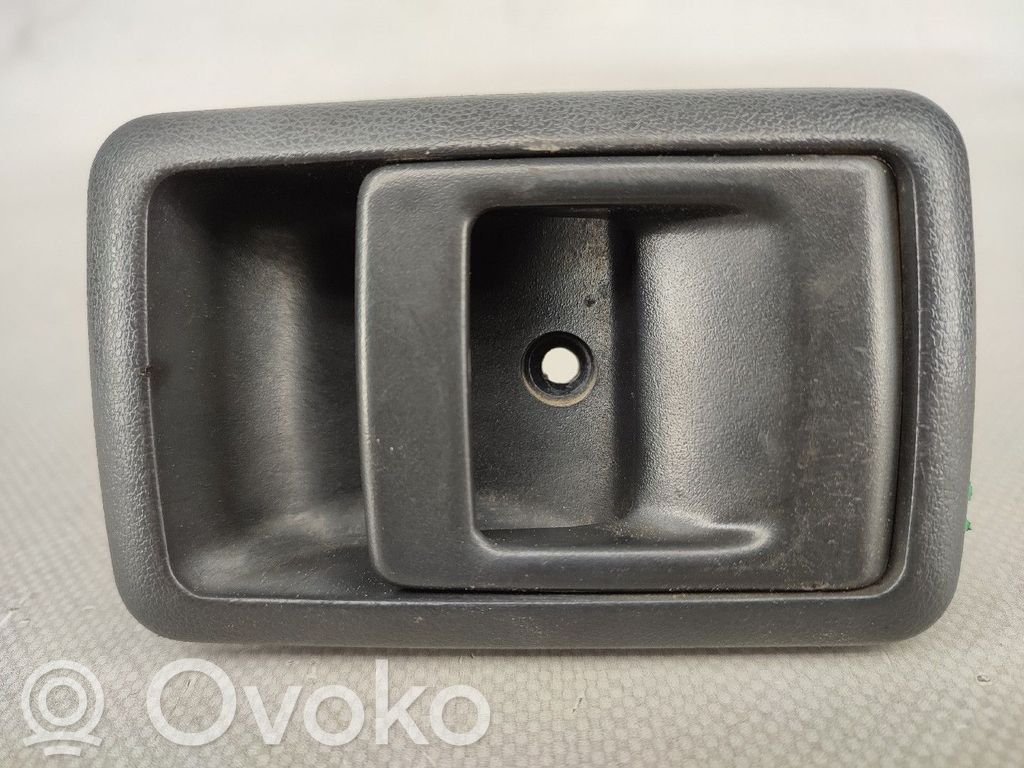 Toyota Corolla E90 Etuoven ulkokahvan kehys 