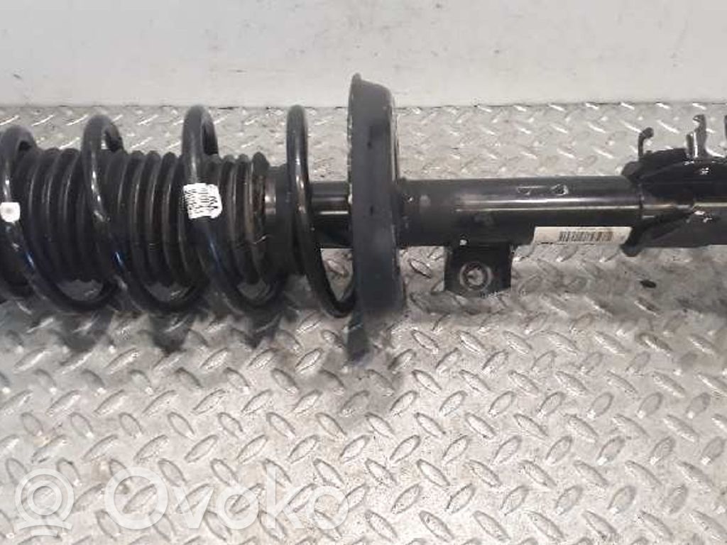 Opel Corsa D Etuiskunvaimennin kierrejousella 