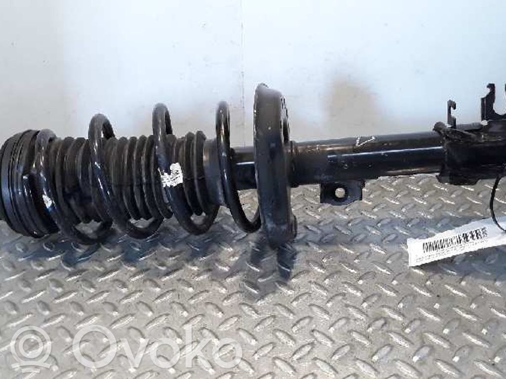 Opel Corsa D Etuiskunvaimennin kierrejousella 