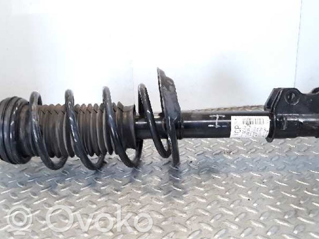 Opel Corsa D Etuiskunvaimennin kierrejousella 