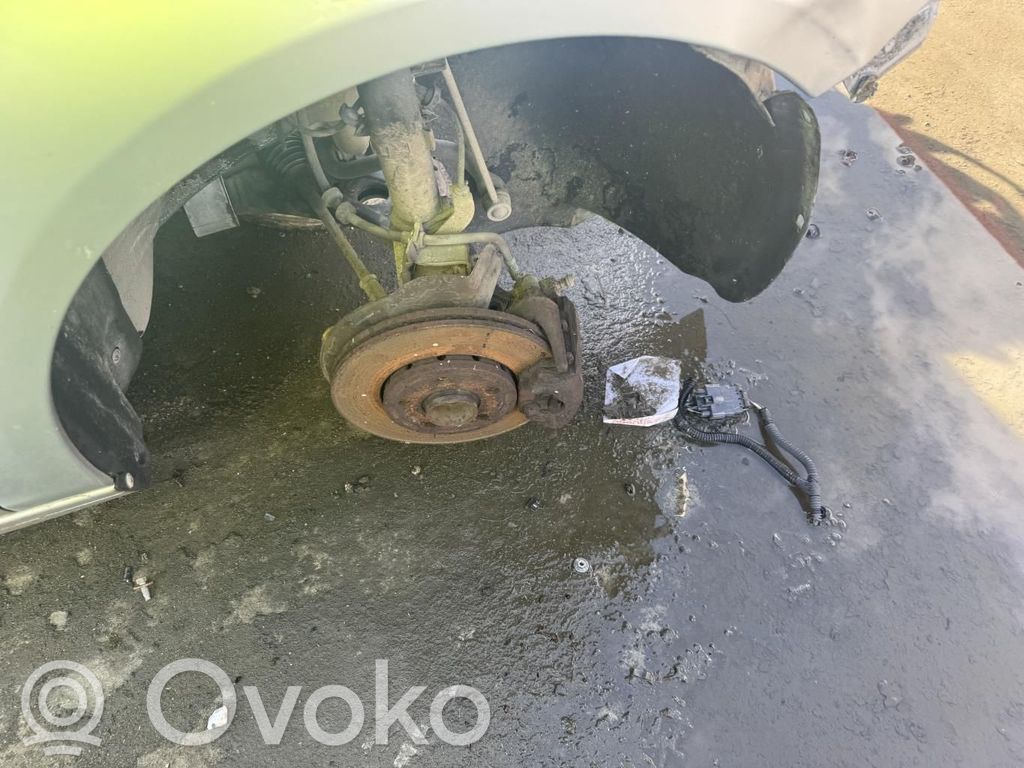 Volkswagen Fox Amortyzator osi przedniej ze sprężyną 