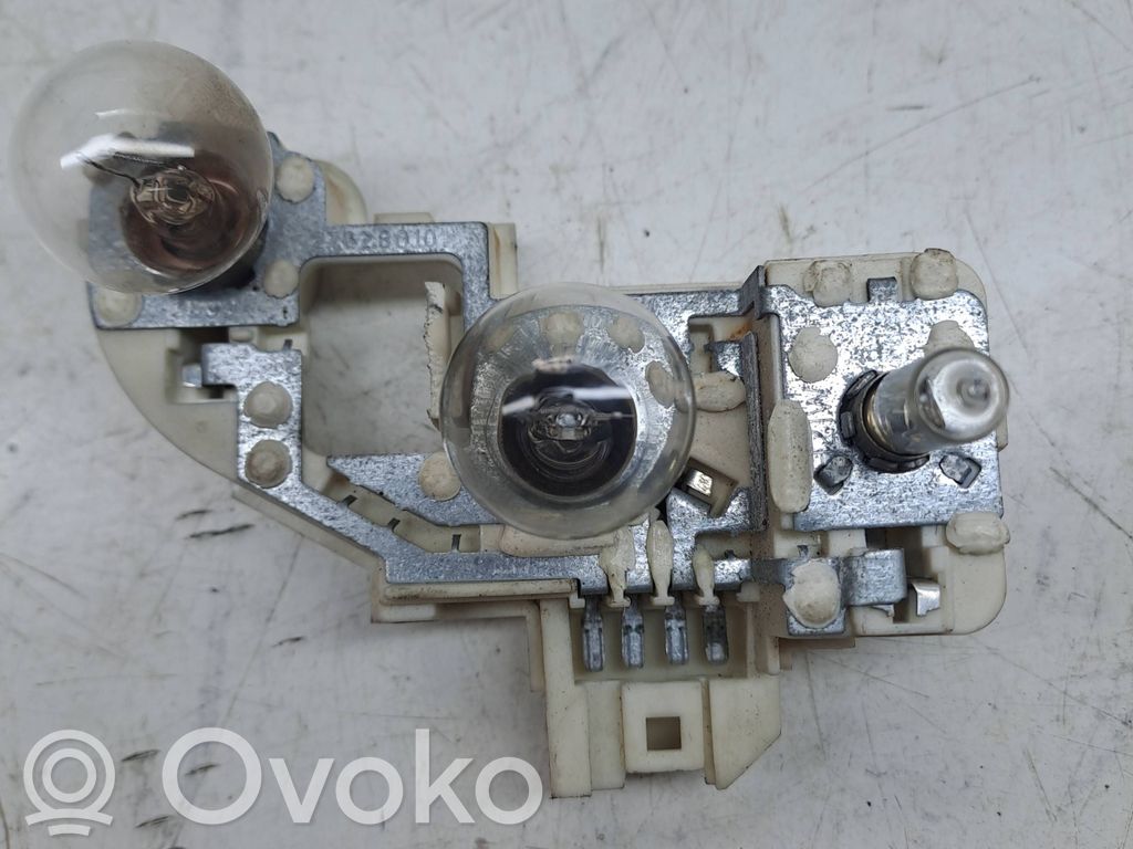 Tail light bulb cover holder   7183844