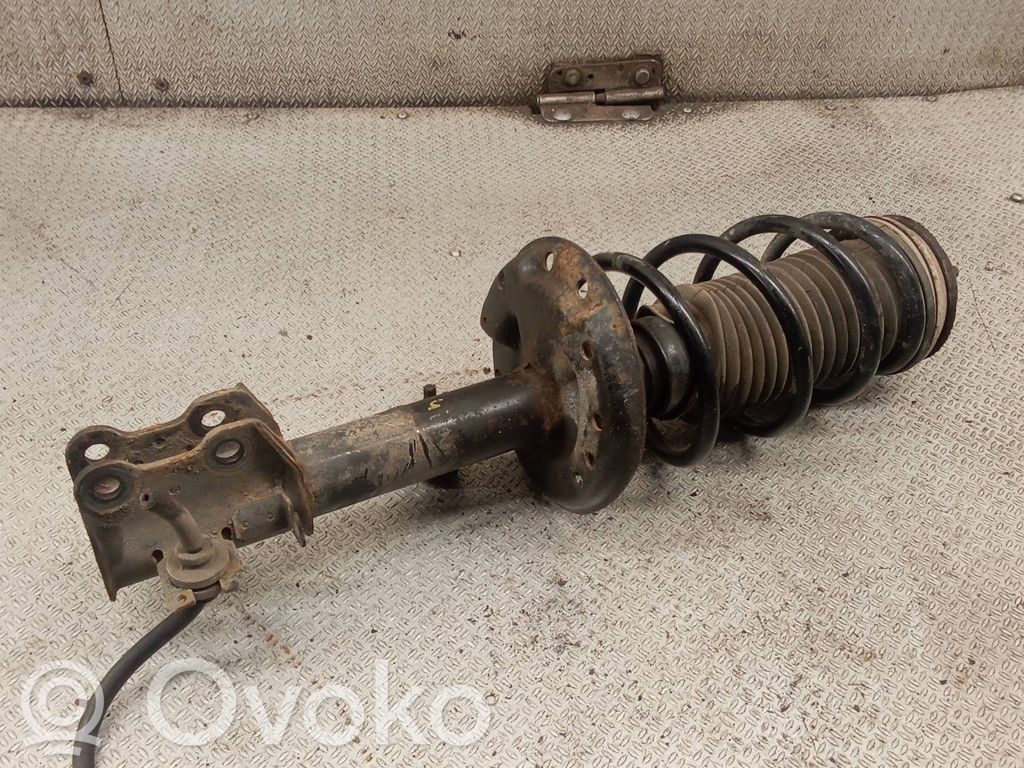 Opel Corsa D Front shock absorber with coil spring 