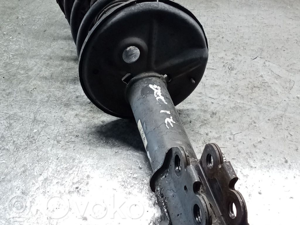 Toyota Corolla E110 Front shock absorber with coil spring 
