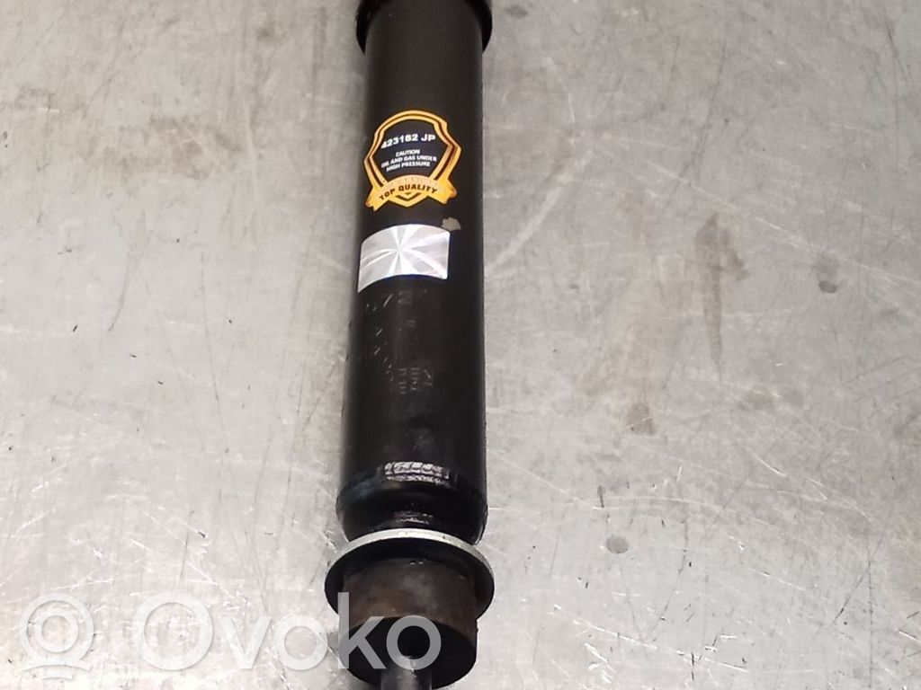 Nissan Patrol 260 Front shock absorber with coil spring 