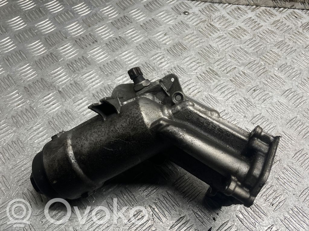 Oil filter mounting bracket   7787698,7787072