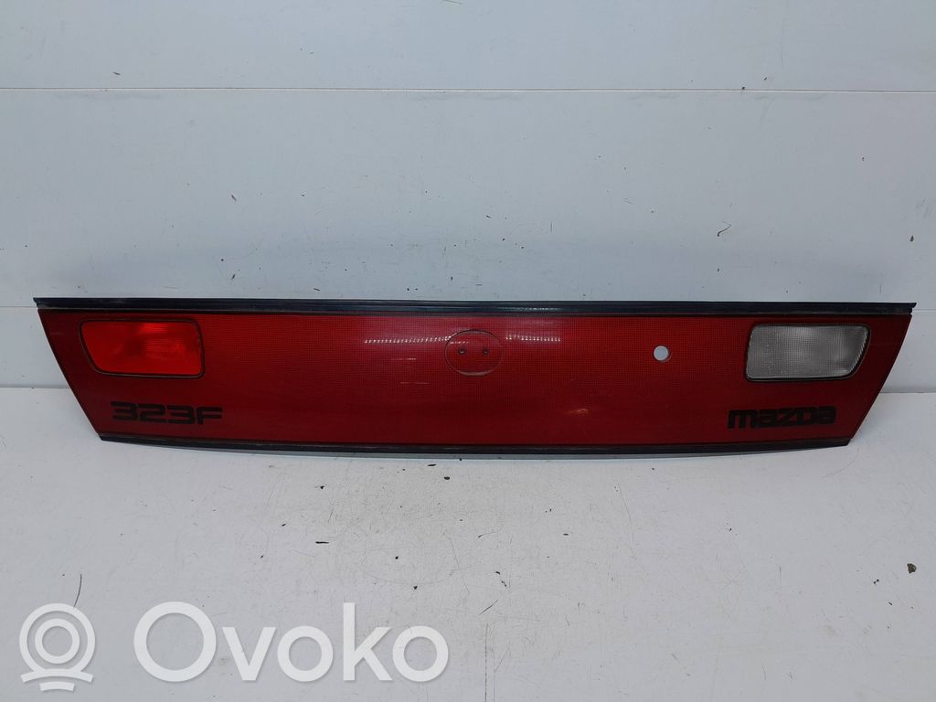 Mazda 323 F Trunk door license plate light bar 