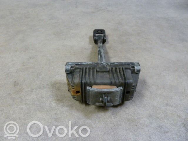 Front door check strap stopper   7176802