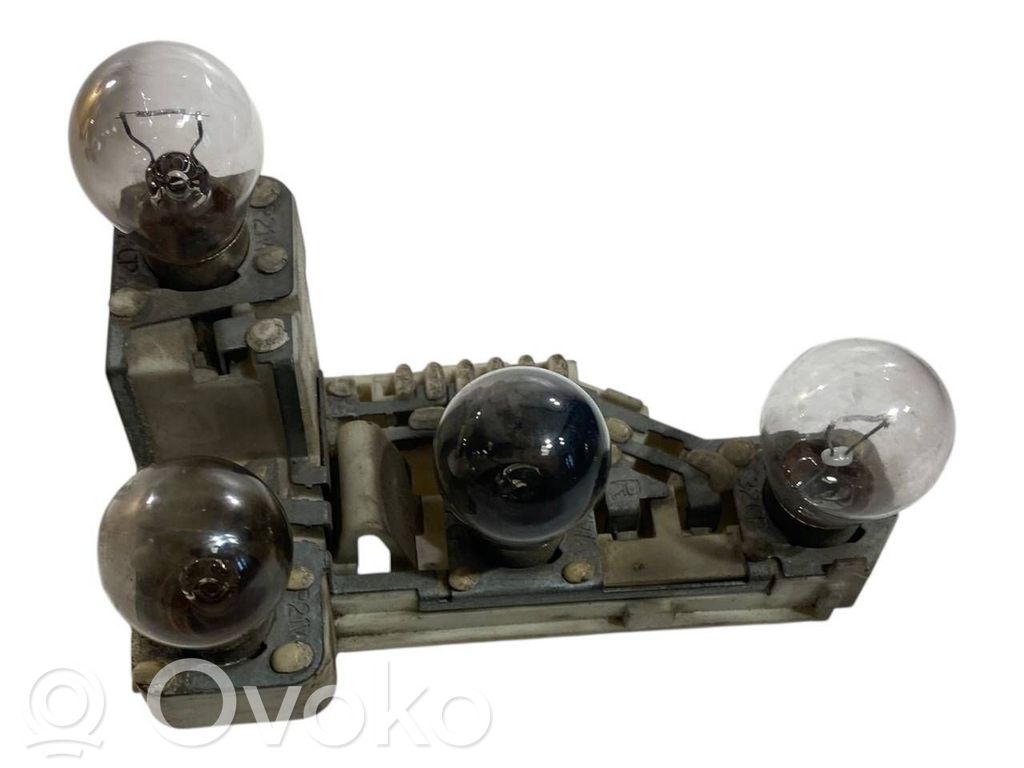 Tail light bulb cover holder   7160076