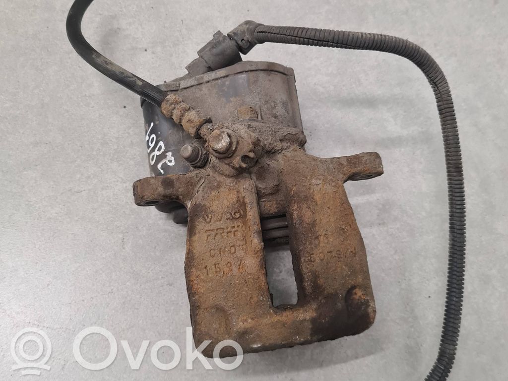 Volkswagen PASSAT B7 Tylny zacisk hamulcowy 