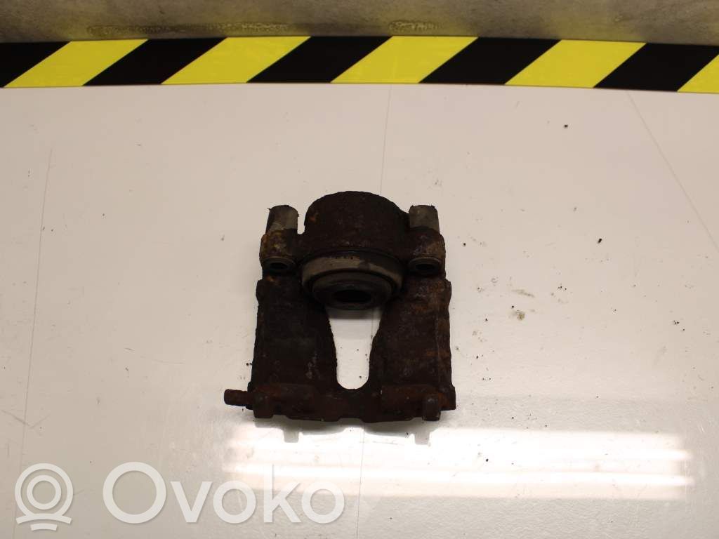 Opel Astra G Zacisk hamulcowy przedni 