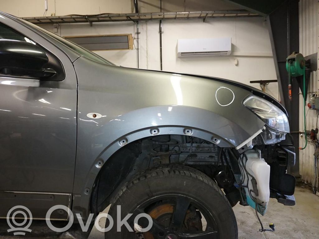 Nissan Qashqai+2 Błotnik przedni 
