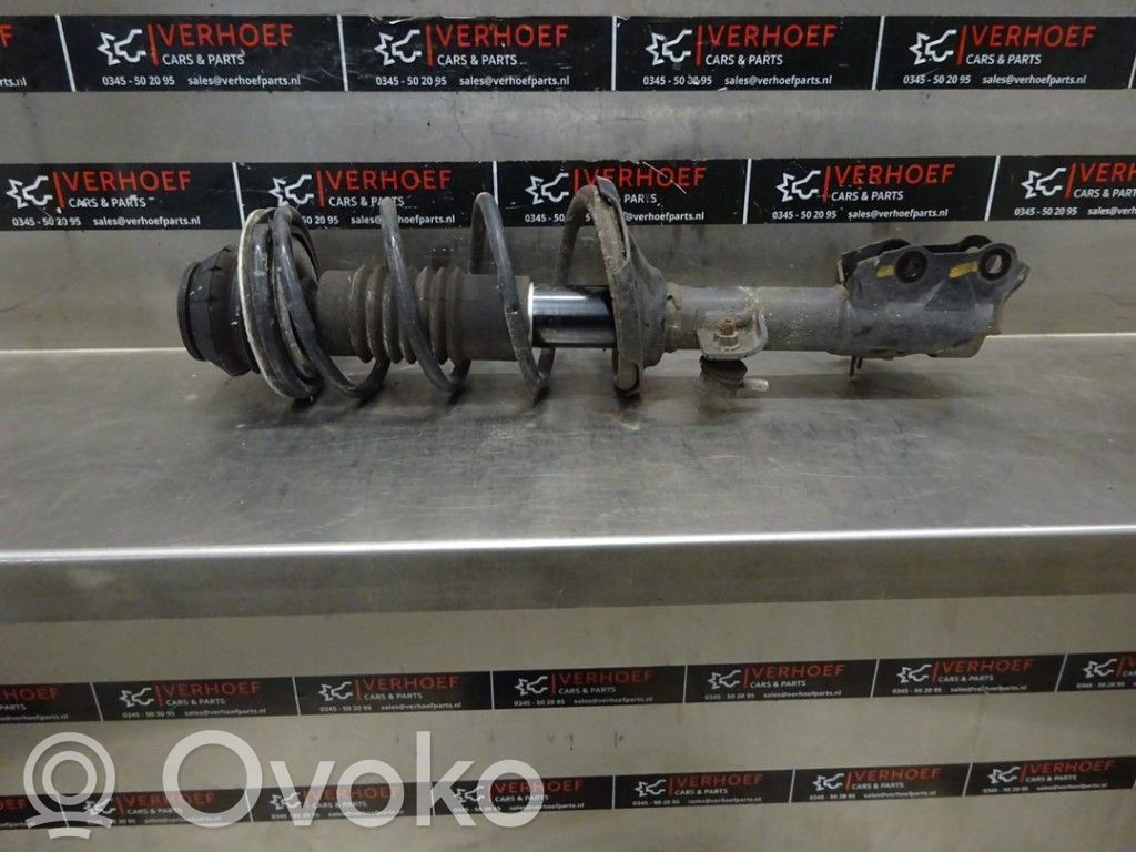 Front shock absorber with coil spring